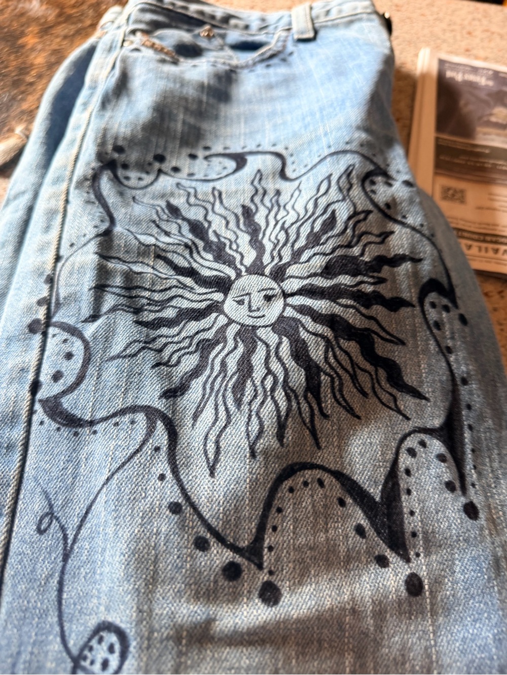 Cruel Girl Light Blue Boot Cut Jeans with Black Sun Graphic